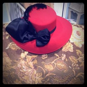 Red hat with black bow and feathers, final price